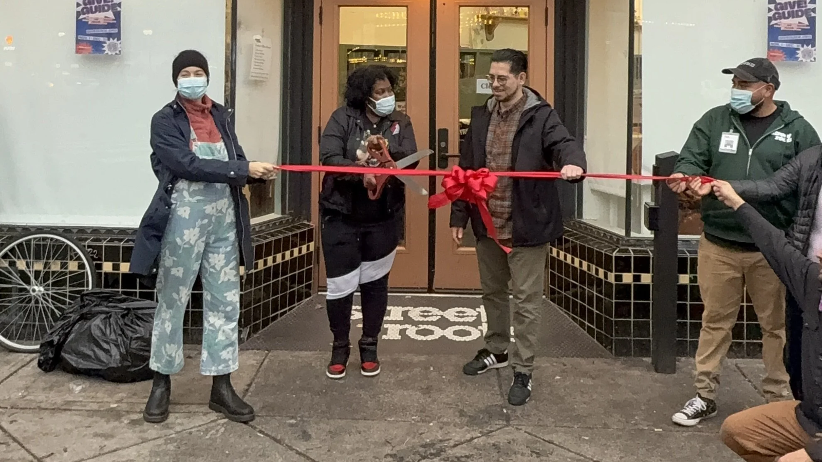 LaQuida cutting the ribbon at the new Street Roots office