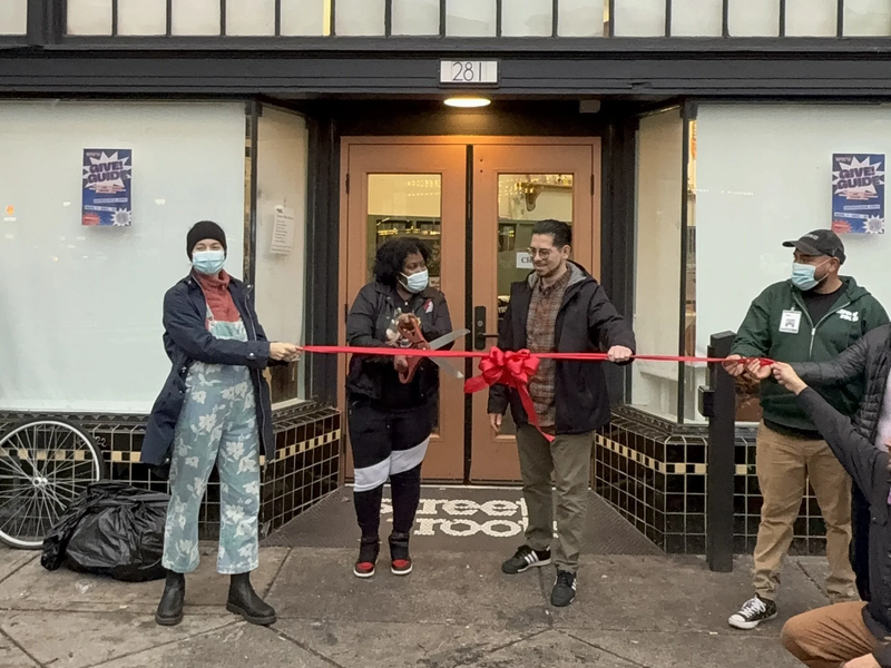 LaQuida cutting the ribbon at the new Street Roots office