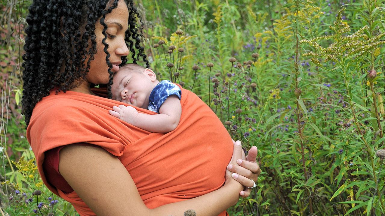 Mother with infant in a sling