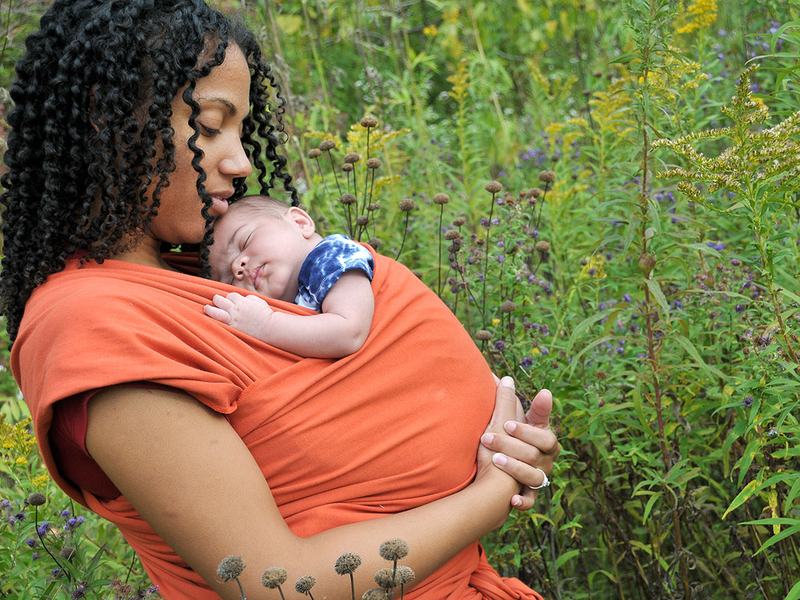 Mother with infant in a sling