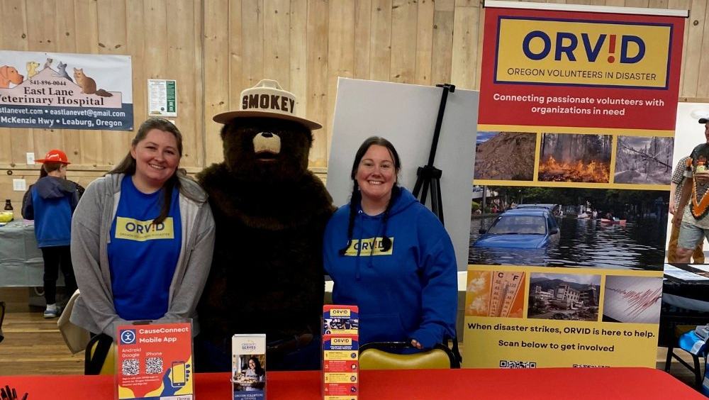 ORVID outreach volunteers and Smokey Bear
