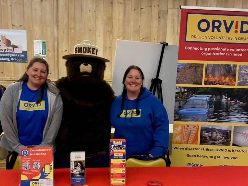 ORVID outreach volunteers and Smokey Bear