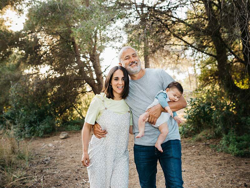 Young family in a wooded setting